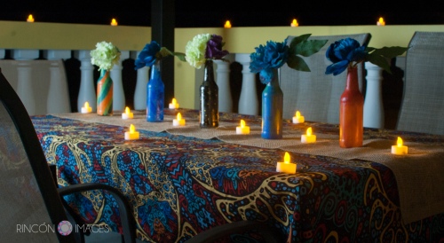 The couple decorated their table with DIY painted bottles and small led tea light candles. The look was very tropical and bohemian.